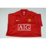 A signed Manchester United player's shirt, that of Quinton Fortune and signed at the Stretford