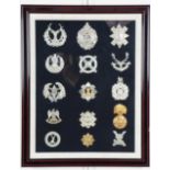 A framed display of Scottish cap badges, 47 cm x 37 cm