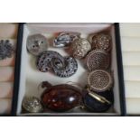 A contemporary faux-reptile skin jewellery case containing a quantity of costume jewellery