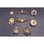 Seven sweetheart brooches of Yorkshire regiments and a regimental association badge