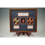A framed presentation Royal Scots Dragoon Guards insignia group