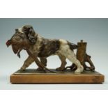 An Austrian cold-painted table lighter modelled as hound retrieving a pheasant, circa 1930s, 25 cm x