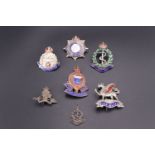 Five enamelled white metal sweetheart brooches and a Royal Artillery white metal charm / pendant, (