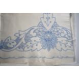 A pair of 1920s floral embroidered white linen single bed covers with matching pillow cases