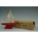 A boxed Critchely Brothers No 978 Firefly toy yacht, 20 cm