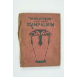 An early 20th Century "Worldwide Illustrated Stamp Album" containing an unsophisticated accumulation