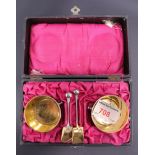 A late 19th / early 20th Century cased set of electroplate and gilt salt cellar modelled as pales,