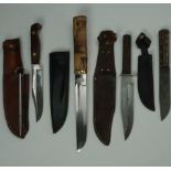 Four various hunting / sports knives including a bamboo-handled knife with Japanese style blade,