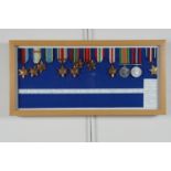A framed collection of Second World War British campaign medals, including a reproduction Air Crew