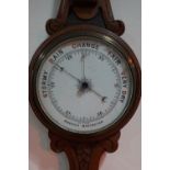 A Victorian carved oak banjo barometer, 84 cm