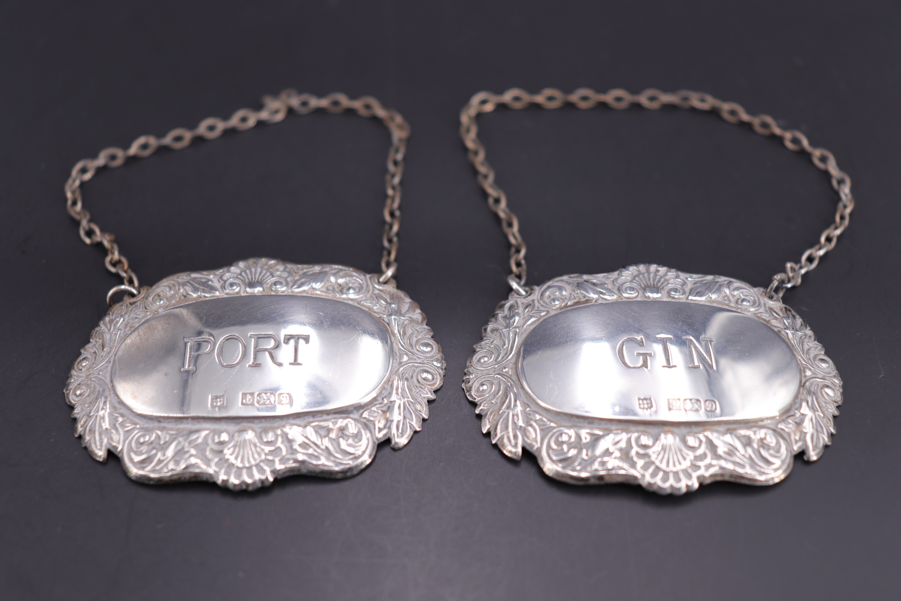 QEII silver bottle tickets, respectively for gin and port decanters