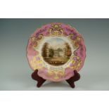 A Victorian Copeland hand-enamelled dessert plate depicting the facade of Goodwood House, 23 cm