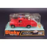 A Dinky 282 die-cast toy Land Rover Fire Appliance together with a 680 Ferret Car, each in