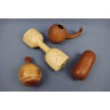 Ethnic gourd and wooden vessels including a rattle
