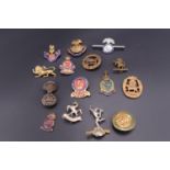 A quantity of sweetheart brooches and regimental association badges