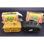 Two 1970s Skeet Tank clockwork disc-firing toy tanks in original cartons