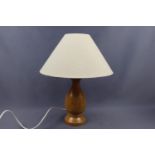 A turned beech table lamp by Gisla Woodcraft of the Isle of Lewis, 38 cm