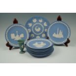 A collection of Wedgwood Jasperware Christmas plates together with a small vase