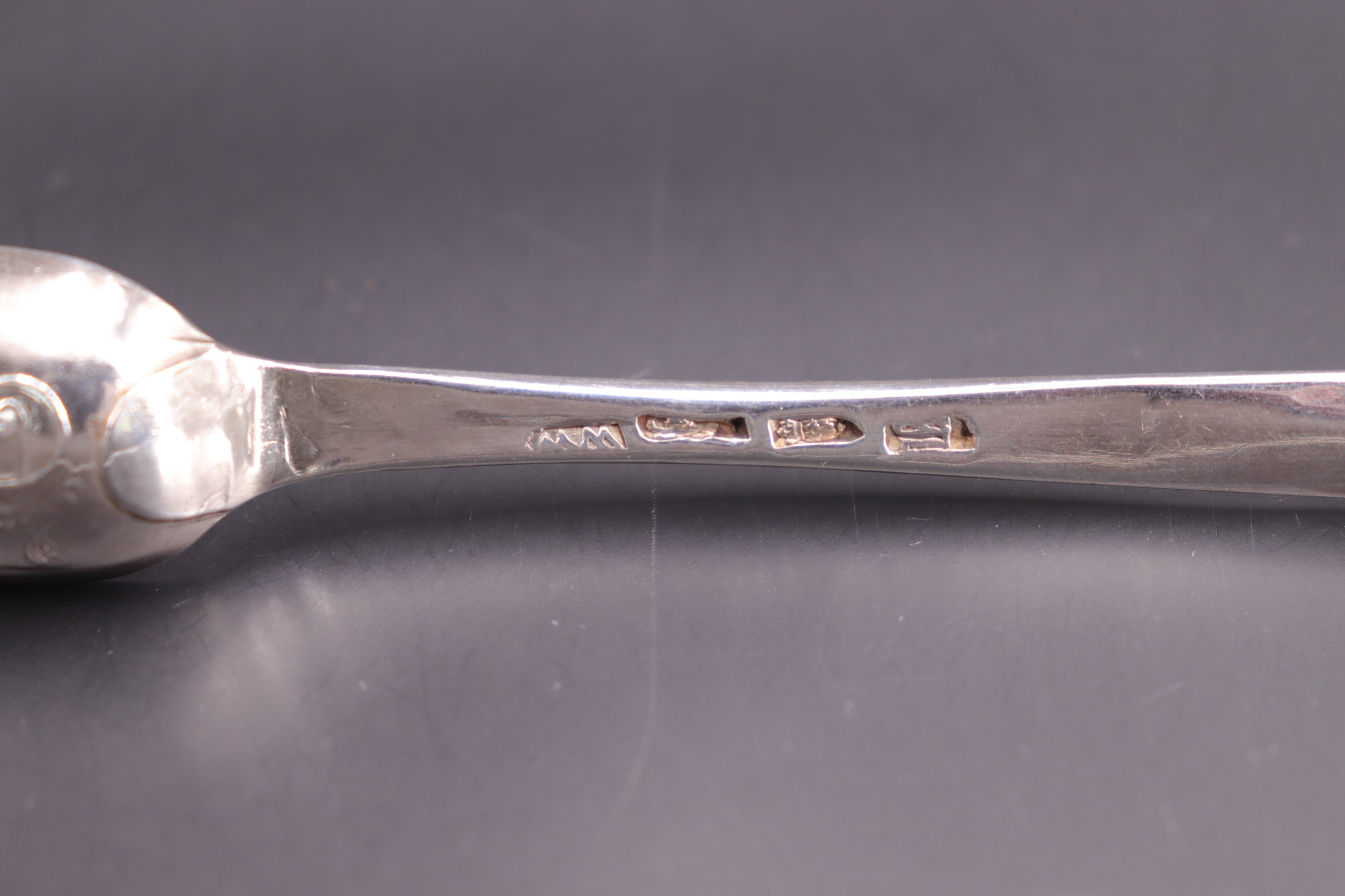 An 18th Century silver scroll-back marrow spoon, bearing engraved marriage marks, WW, London, likely - Image 2 of 3