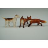 Two Beswick foxes and a hound, (all a/f)