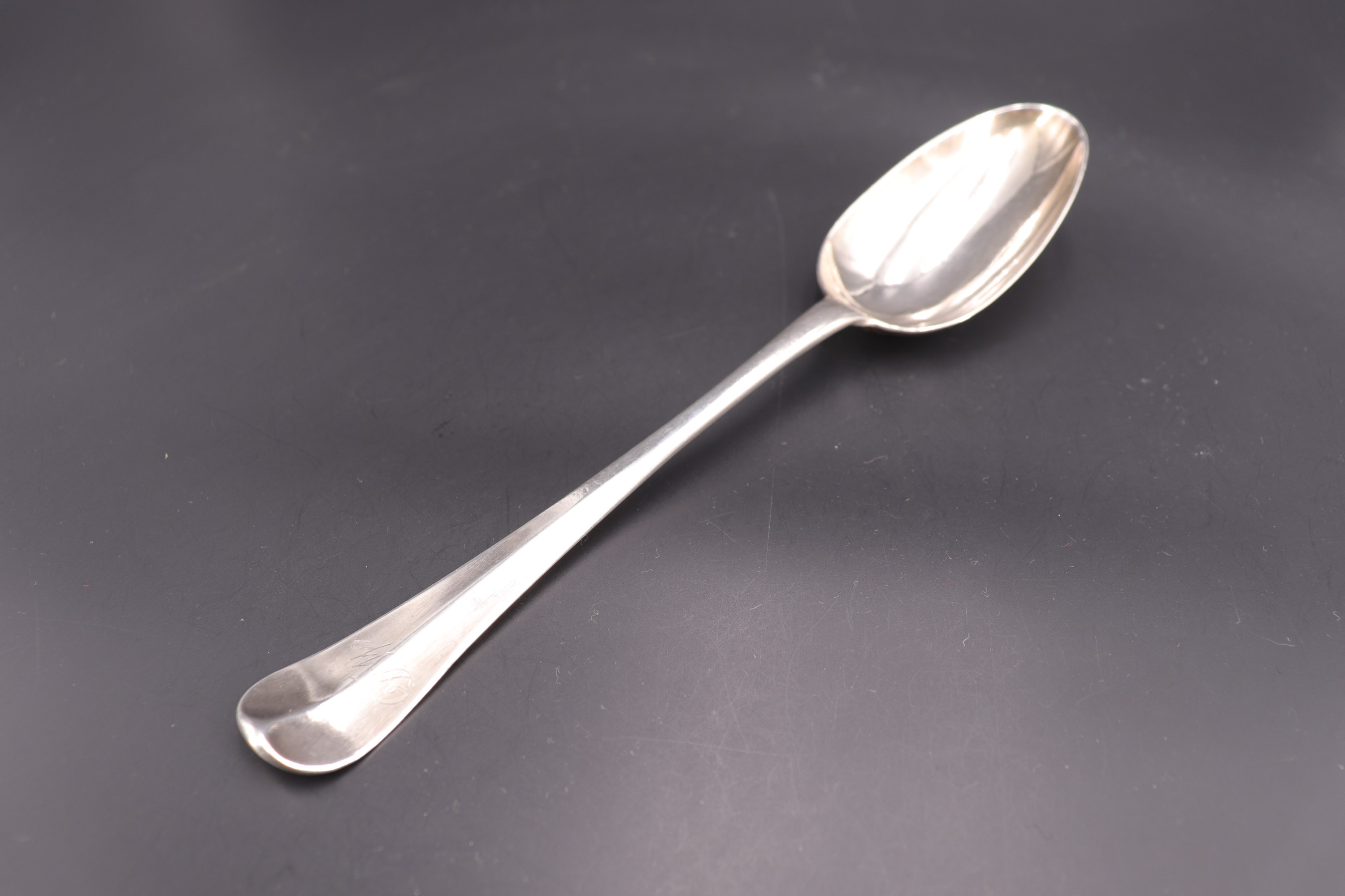 A George II silver Hanoverian pattern table spoon, bearing engraved initial to each face of the