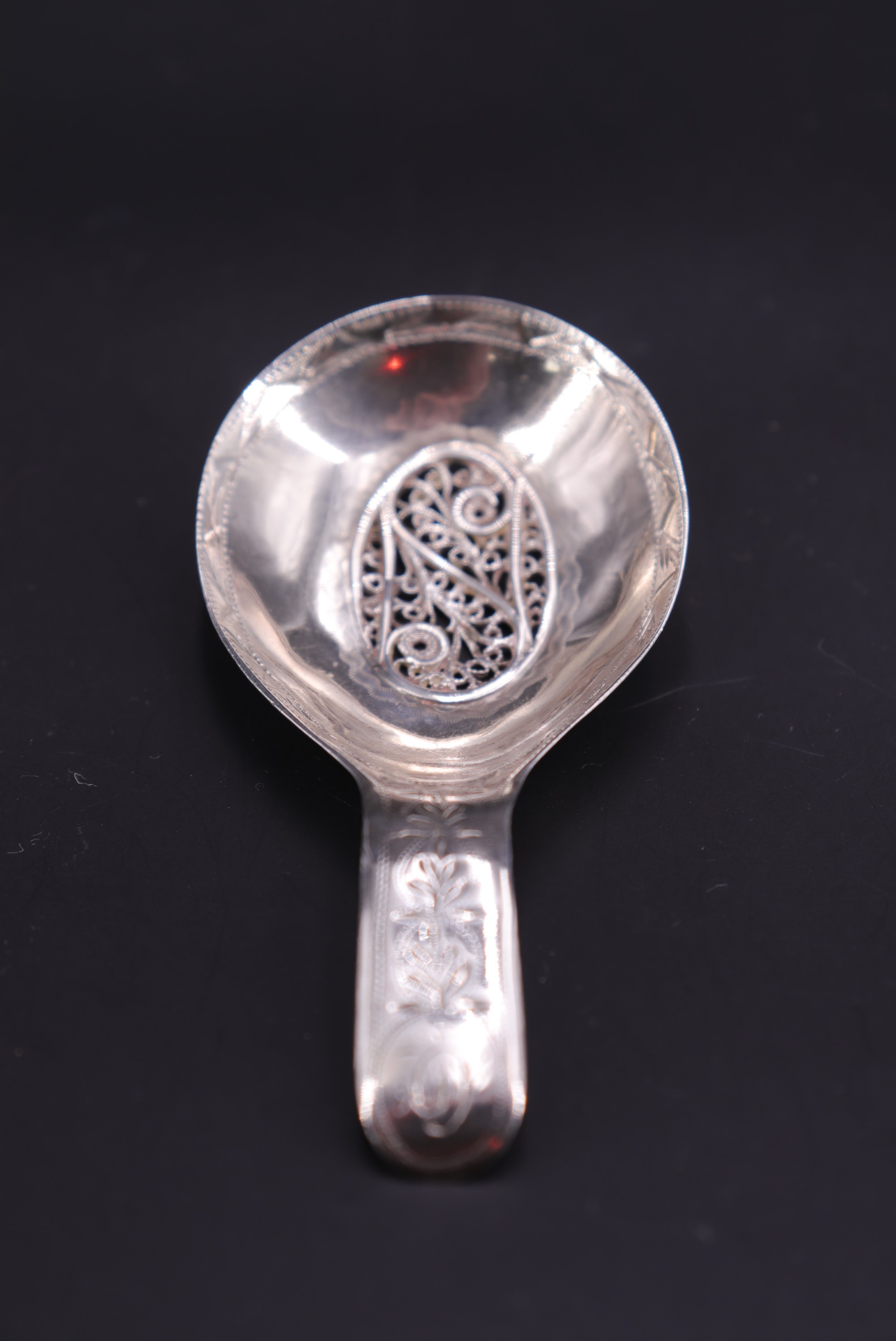 A George III engraved and filigree-inset silver caddy spoon, sponsor's mark indistinct,