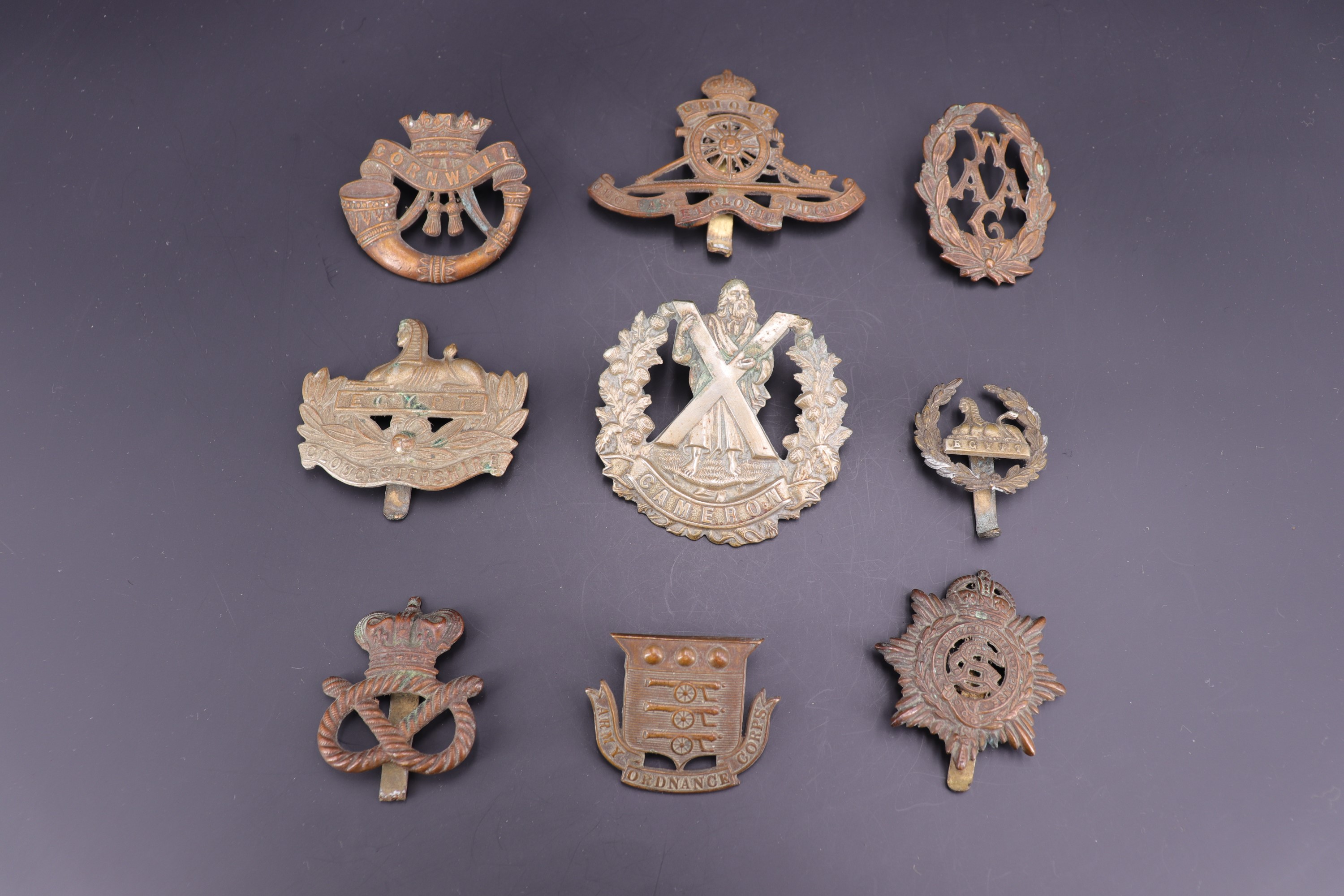 Sundry Victorian and early 20th Century British army cap badges including a Victorian Ordnance Corps