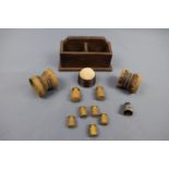 Sundry collectors' items including brass weights, a turned wooden pin cushion, white metal thimble