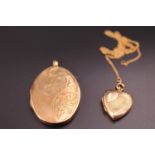 Two rolled gold pendant lockets and a yellow metal fine link neck chain, oval locket 43 x 33 mm