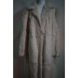 A 1940s lady's ermine coat, with stepped collar, 20" across back