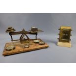 A set of Victorian brass letter scales and sundry weights, together with a desk perpetual