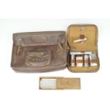 A vintage hide document valise / briefcase, circa 1930s - 1950s, together with a travel grooming set