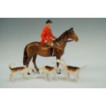 A Beswick huntsman and three hounds