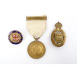 A Great War British Red Cross War service medal together with a 1915 munitions worker's badge and
