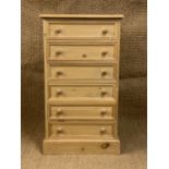 A contemporary slender pine chest of drawers, 60 cm x 37 cm x 106 cm