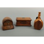 A 1920s patented oak musical casket, of barrel form, a wooden flask from an old New Zealand Totara