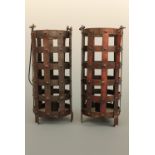 A pair of pendant latticed patinated-iron candle lamps, 20 cm high
