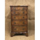 A reproduction Georgian serpentine-fronted mahogany chest of drawers of diminutive stature, 53 cm