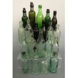 A quantity of antique internal screw stopper glass bottles