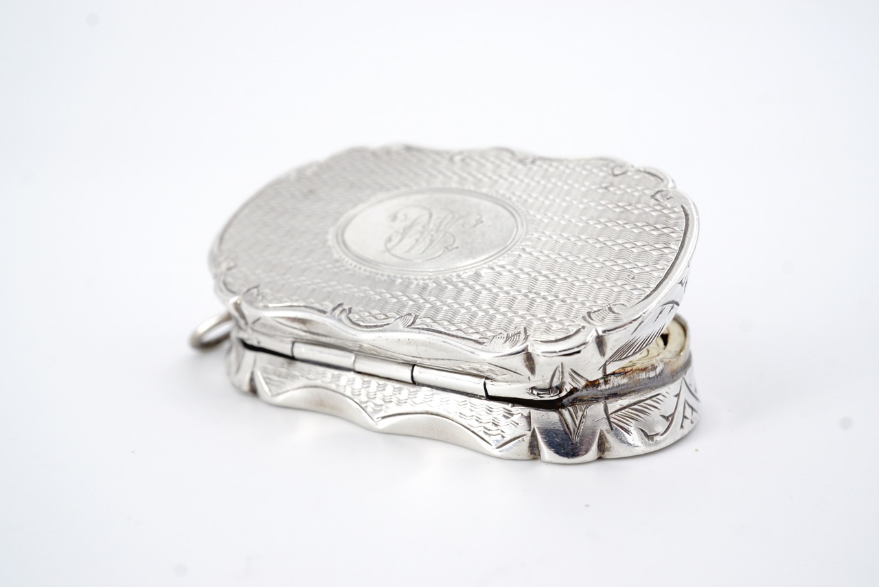 A Victorian silver fob vinaigrette, of oval section with a cusped rim and engraved sides, the covers - Image 3 of 3