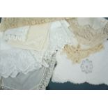 A quantity of predominantly Victorian and Edwardian domestic white linens, including two