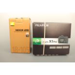 A Fujifilm Finepix S5 Pro DSLR camera with Nikon Nikkor AF-S DX 18-105mm f/3.5-5.6G ED VR lens, with