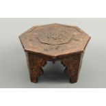 An oriental carved wooden stand or stool, 30 cm x 20 cm