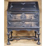 A 1920s ebonised oak Jacobean style fall front bureau of diminutive stature, 76 cm x 42 cm x 102 cm