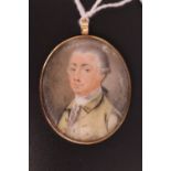 A George III wedding pendant or love token, obverse a portrait miniature of a bewigged gentleman