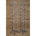 A pair of contemporary wrought iron wine racks, 133 cm