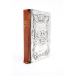 An Edwardian silver mounted Book of Common Prayer, the cover relief moulded with the winged heads of