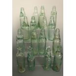 A quantity of antique Codd's patent glass bottles