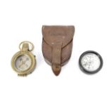 An early 20th Century military type prismatic marching compass in leather pouch, together with a "