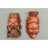 Two Balinese carved wooden wall masks, 13 cm